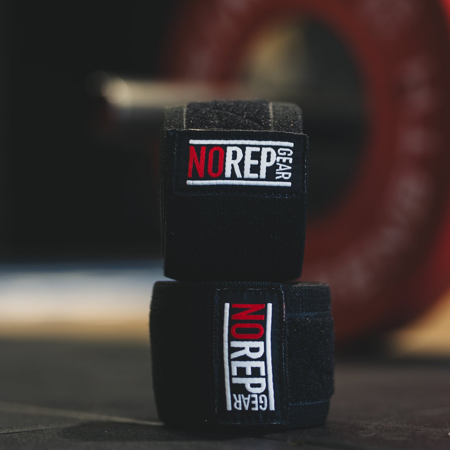 Two black hand wraps with 'NRG' branding