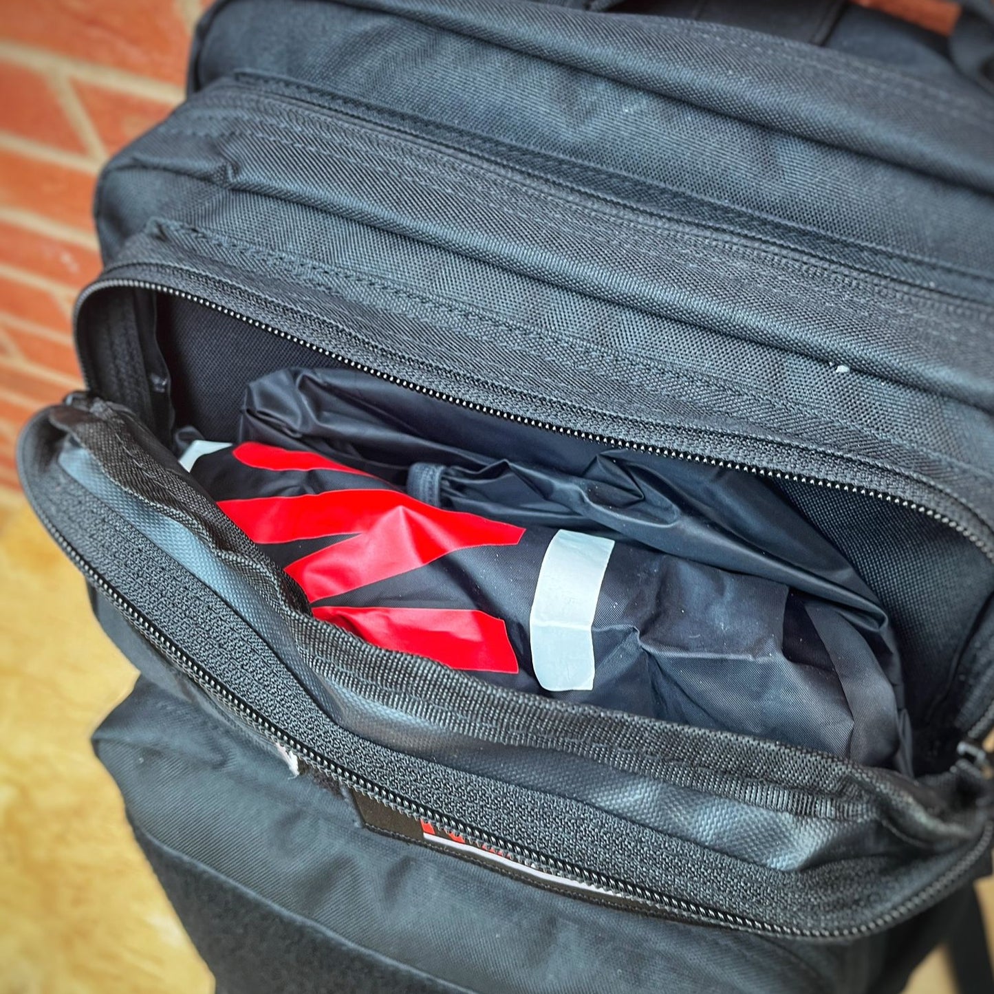 Stored waterproof backpack cover