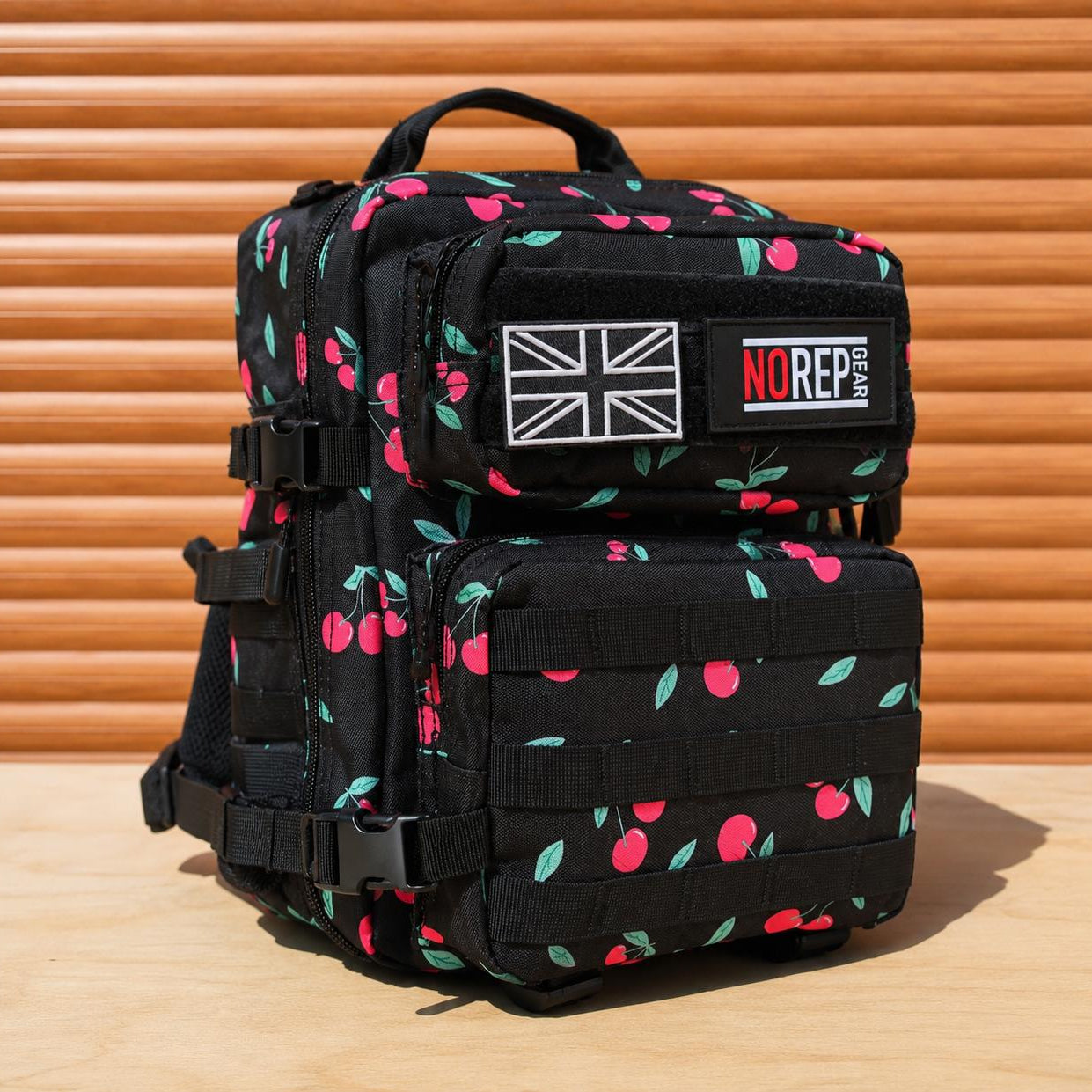 Black tactical backpack with cherry pattern 