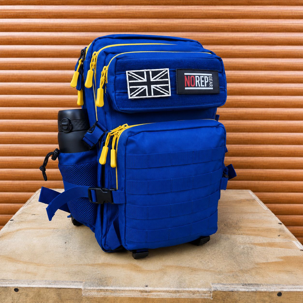 Blue tactical backpack with yellow zips