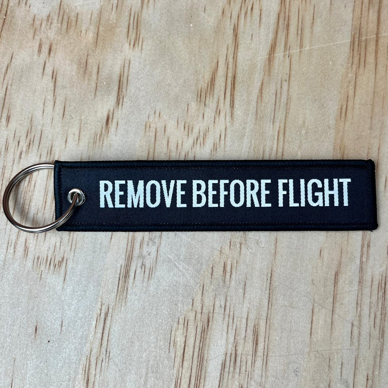 Remove before flight keyring, black