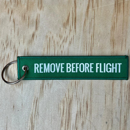 Remove before flight keyring, green