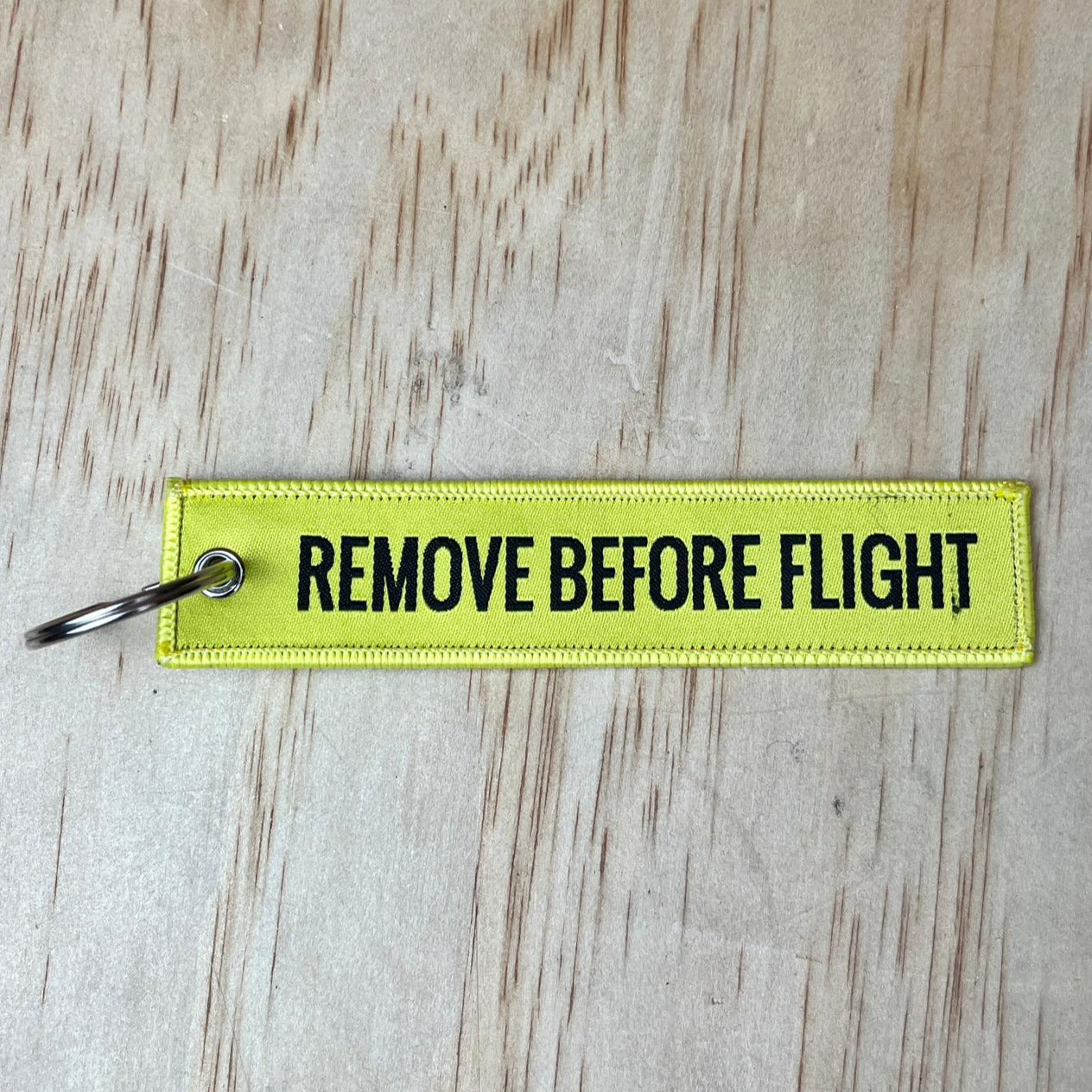 Remove before flight keyring, yellow