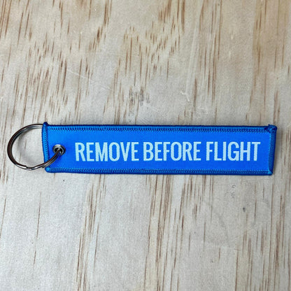 Remove before flight keyring, blue