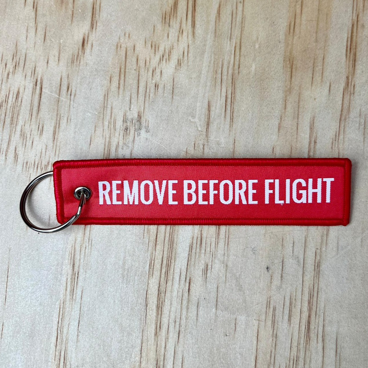 Remove before flight keyring, red